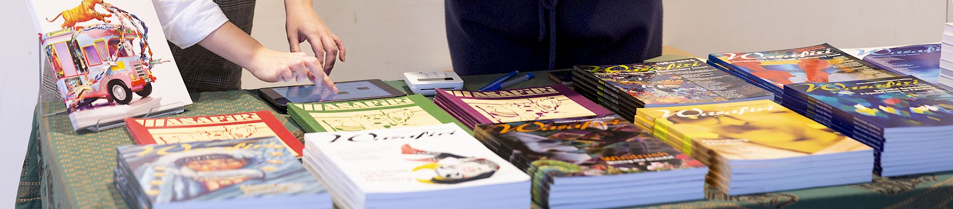 A shelf of folders showing various issues of Wasafiri